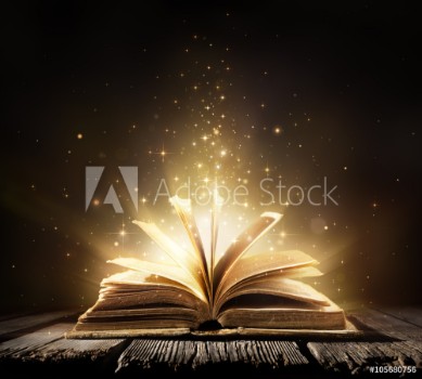 Picture of Old Book With Magic Lights On Vintage Table